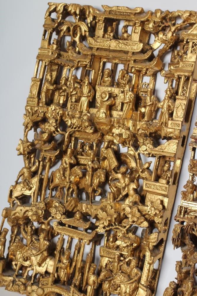 A CHINESE CARVED AND PIERCED GILTWOOD PANEL Image