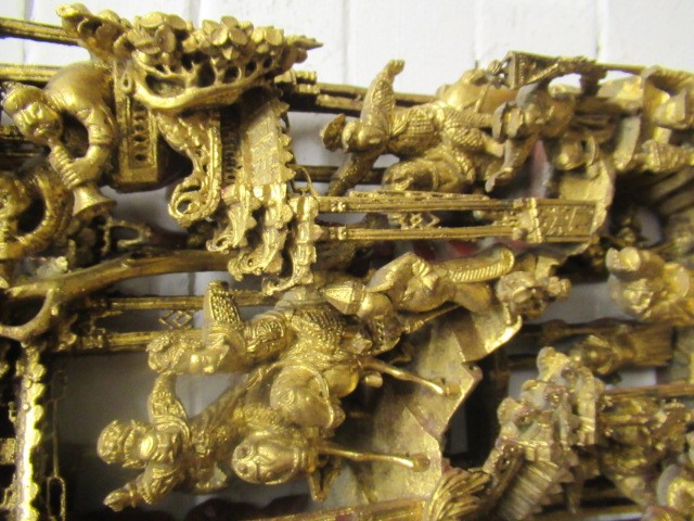 A CHINESE CARVED AND PIERCED GILTWOOD PANEL Image