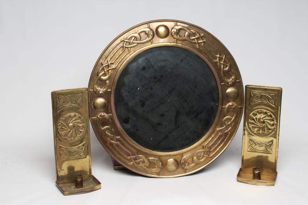 AN ARTS & CRAFTS BRASS WALL MIRROR Image