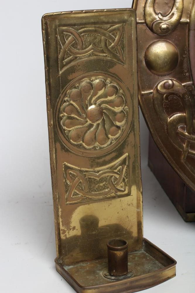 AN ARTS & CRAFTS BRASS WALL MIRROR Image