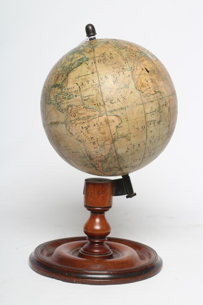 A DESK TOP EDUCATIONAL TERRESTRIAL GLOBE by C Smith & Sons London, early 20th century, the mahogany Image