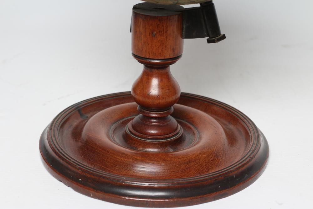 A DESK TOP EDUCATIONAL TERRESTRIAL GLOBE by C Smith & Sons London, early 20th century, the mahogany Image
