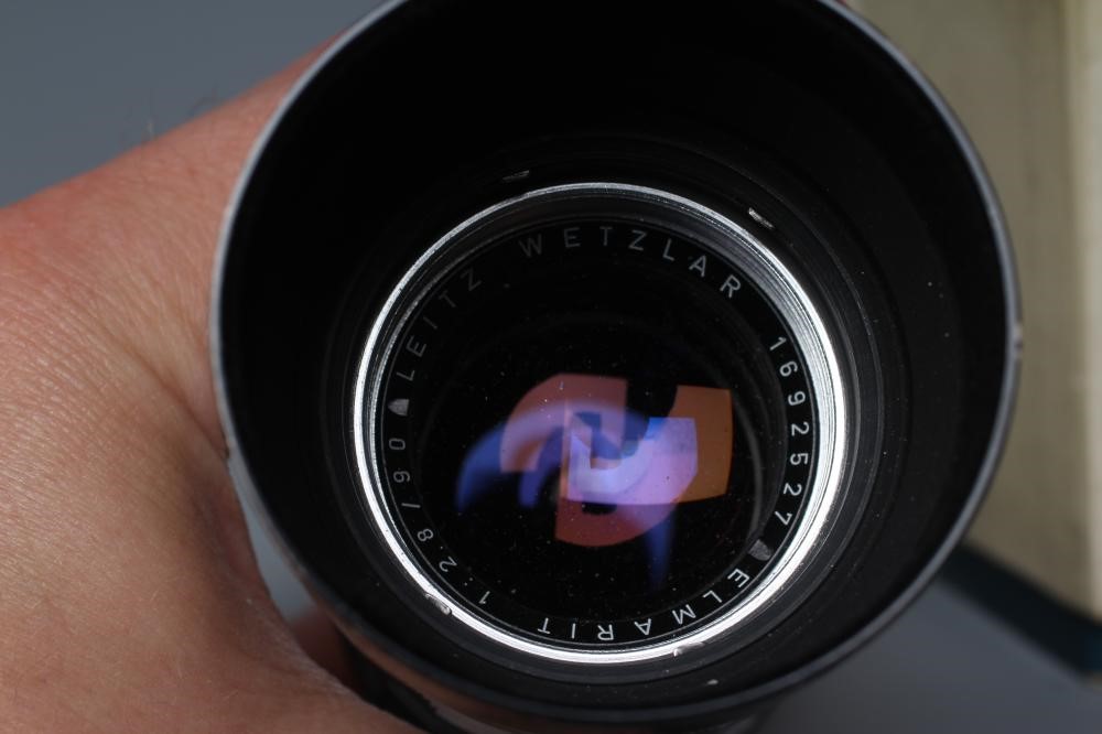A LEITZ WETZLAR ELMARIT LENS, 1:2.8/90, 1692527, together with a Leitz Visoflex II (2) (Est. plus Image