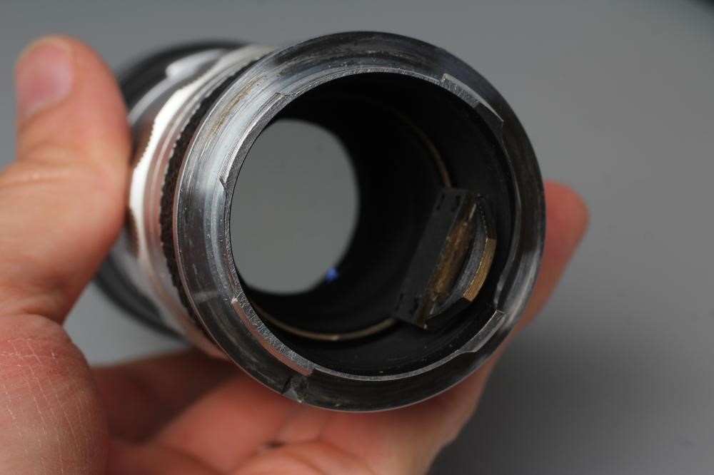 A LEITZ WETZLAR ELMARIT LENS, 1:2.8/90, 1692527, together with a Leitz Visoflex II (2) (Est. plus Image