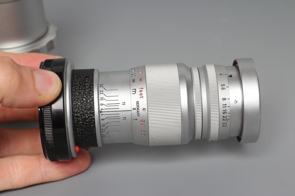 TWO LEITZ WETZLAR ELMAR LENSES, comprising a 1:4/135 1902210 and a 1:4/90 1822376 (Est. plus 24% Image