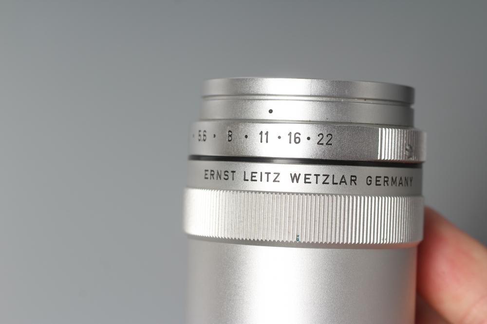 TWO LEITZ WETZLAR ELMAR LENSES, comprising a 1:4/135 1902210 and a 1:4/90 1822376 (Est. plus 24% Image