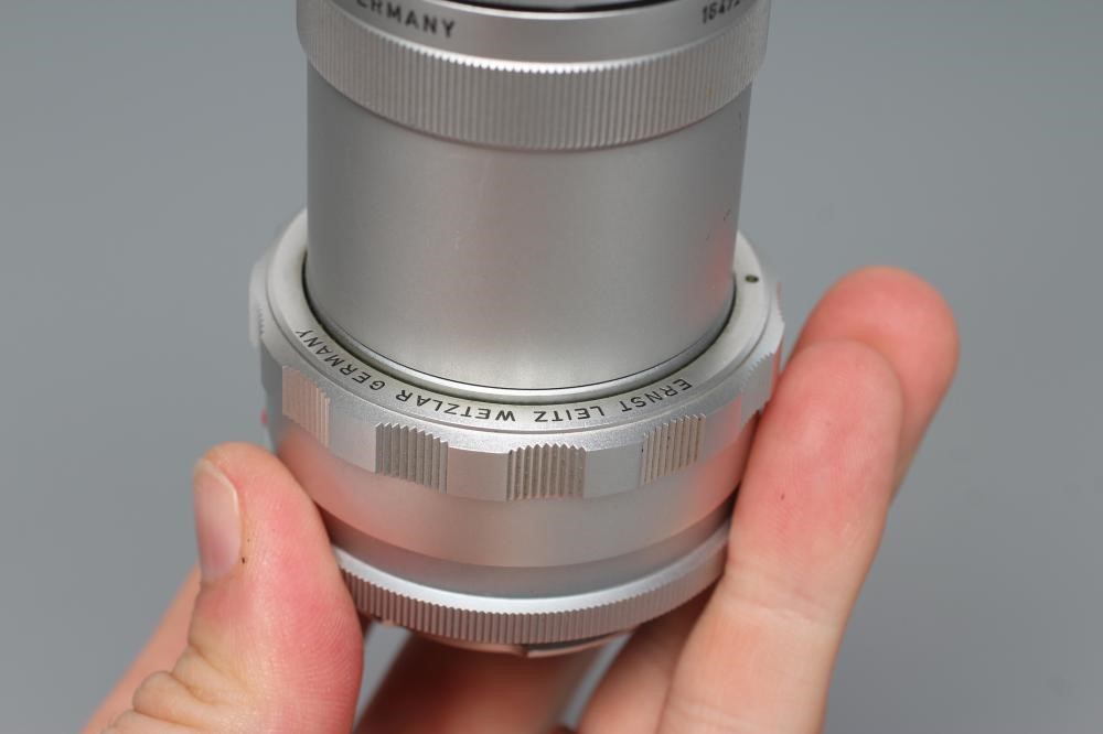 TWO LEITZ WETZLAR ELMAR LENSES, comprising a 1:4/135 1902210 and a 1:4/90 1822376 (Est. plus 24% Image