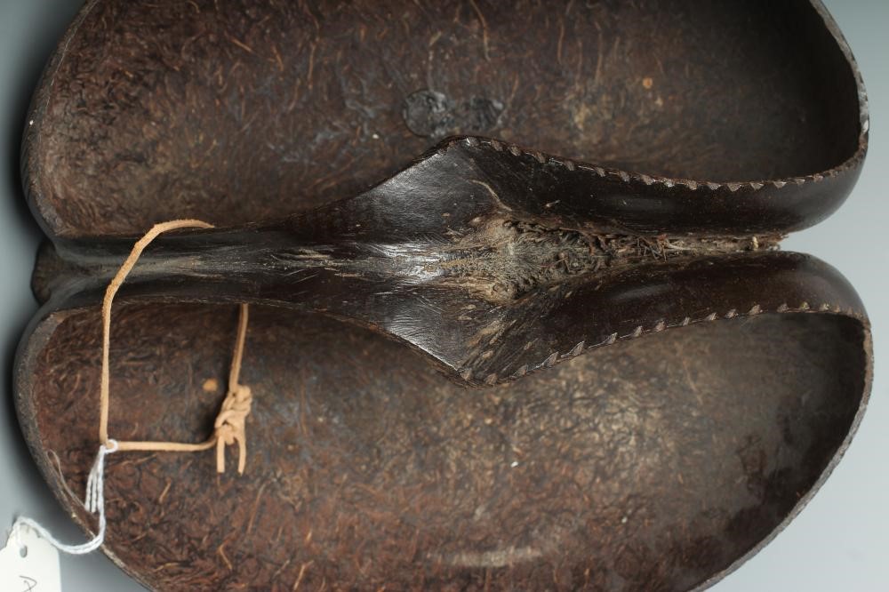 A COCO DE MER carved as a double-welled basket, with etched rim and polished exterior, 10 1/4" long Image