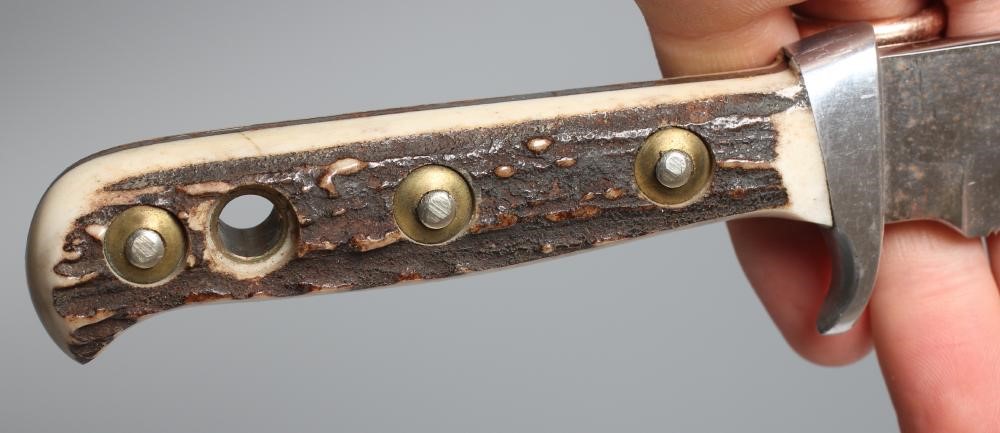 A PUMA 8396 ORIGINAL BOWIE KNIFE, 16281, with 6 1/2" clip point blade, two piece antler grips and Image