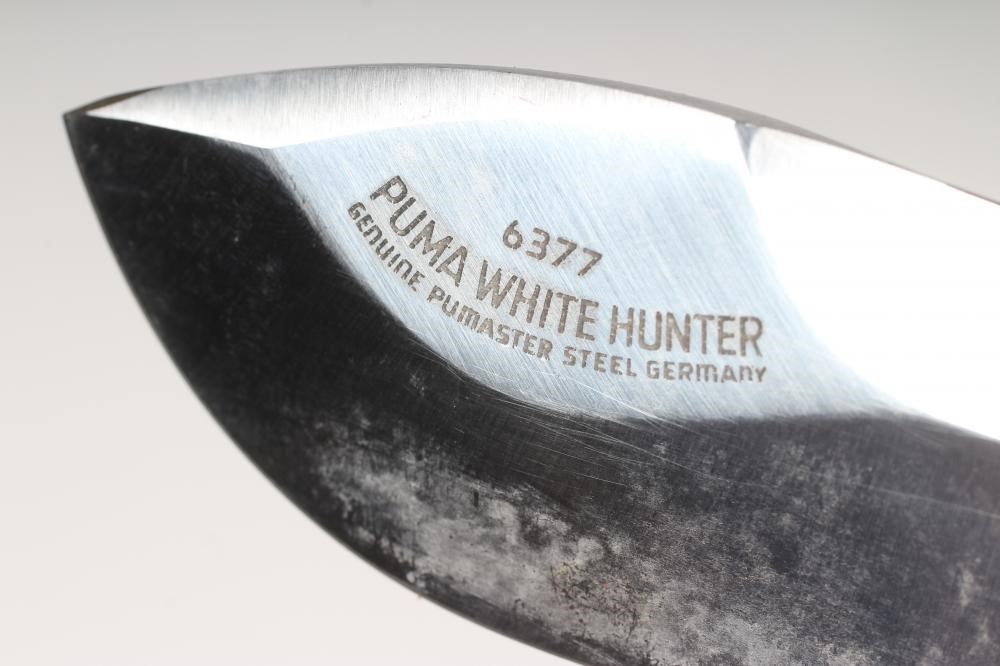 A PUMA 6377 WHITE HUNTER KNIFE, 42607, with 6" heavy blade, two piece antler grips and leather Image