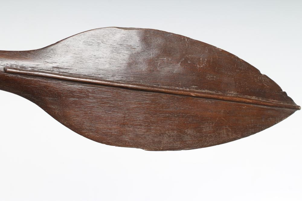 A SOLOMAN ISLANDS PADDLE CLUB of hard wood construction with leaf to one end and spike on the other, Image
