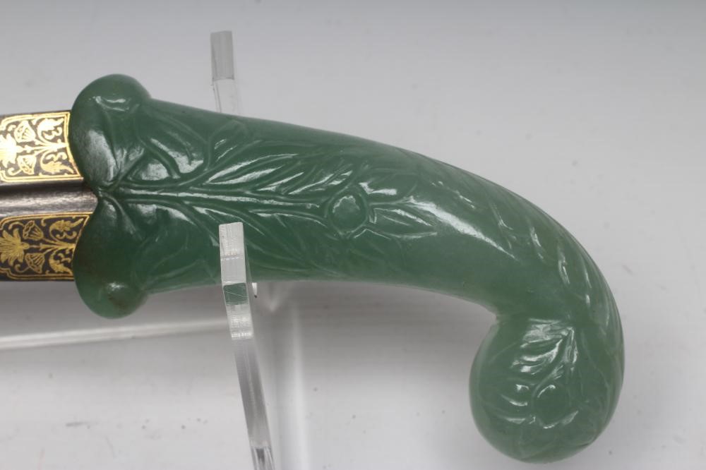A MUGHAL TYPE DAGGER, the 10 1/8" serpentine blade inlaid with gold metal flowers, the typical jade Image