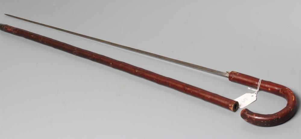 A SWORD STICK, early 20th century, with 28 1/2" square section blade, wood cane and crooked handle, Image