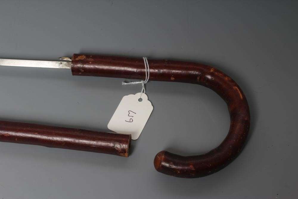 A SWORD STICK, early 20th century, with 28 1/2" square section blade, wood cane and crooked handle, Image