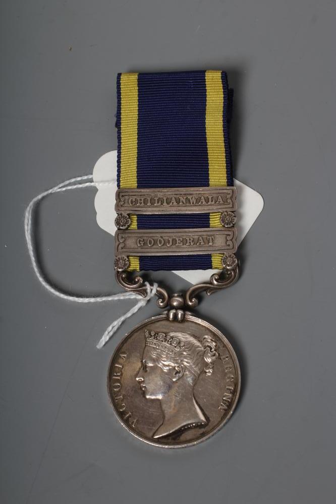 A VICTORIAN PUNJAB MEDAL 1848-49, with blue and yellow ribbon, two clasps for Chilianwala and Image