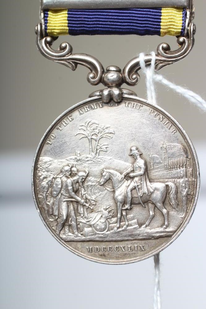 A VICTORIAN PUNJAB MEDAL 1848-49, with blue and yellow ribbon, two clasps for Chilianwala and Image