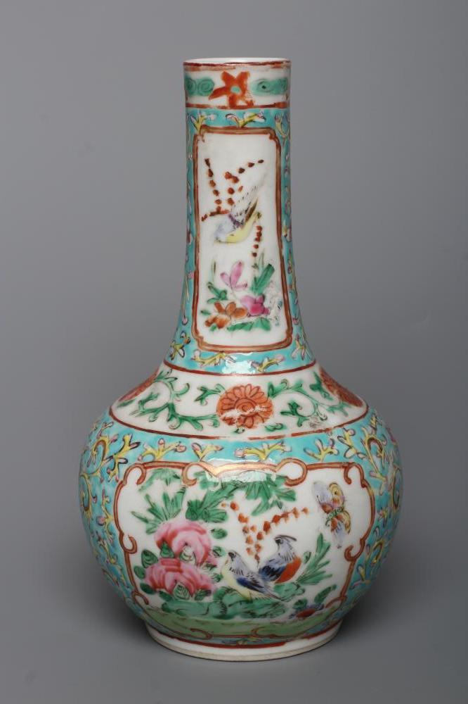 A CHINESE PORCELAIN BOTTLE VASE painted in colours with panels of flowers, birds and butterflies on Image