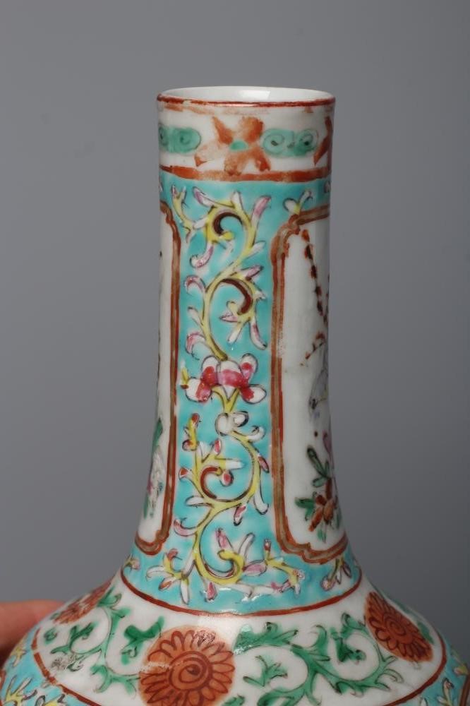 A CHINESE PORCELAIN BOTTLE VASE painted in colours with panels of flowers, birds and butterflies on Image