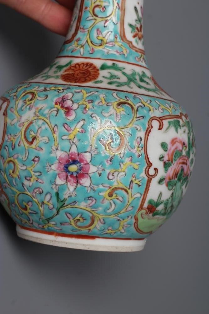 A chinese porcelain bottle vase painted in colours with panels of ...