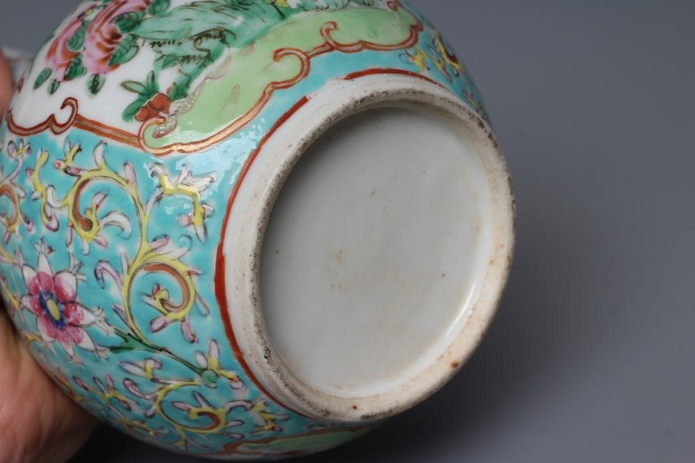 A CHINESE PORCELAIN BOTTLE VASE painted in colours with panels of flowers, birds and butterflies on Image