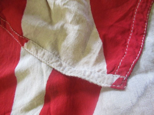 JAPANESE SECOND WORLD WAR ITEMS, comprising a sun flag, a silk script pennant and an Imperial Army Image