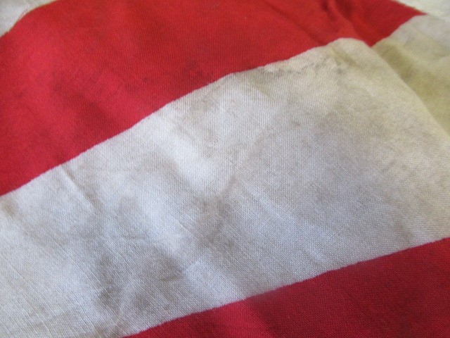 JAPANESE SECOND WORLD WAR ITEMS, comprising a sun flag, a silk script pennant and an Imperial Army Image