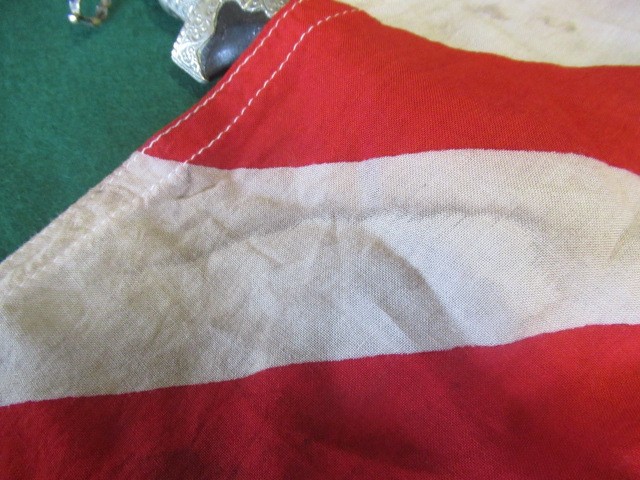 JAPANESE SECOND WORLD WAR ITEMS, comprising a sun flag, a silk script pennant and an Imperial Army Image