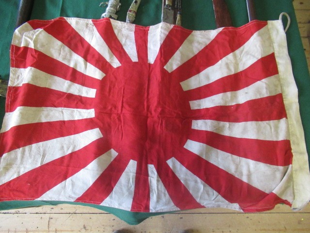 JAPANESE SECOND WORLD WAR ITEMS, comprising a sun flag, a silk script pennant and an Imperial Army Image