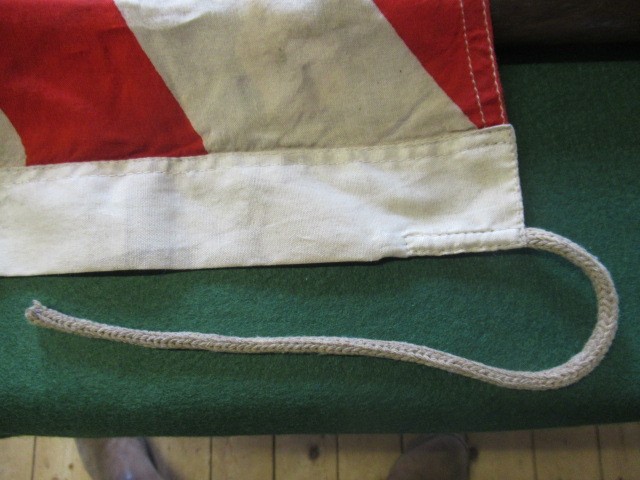 JAPANESE SECOND WORLD WAR ITEMS, comprising a sun flag, a silk script pennant and an Imperial Army Image