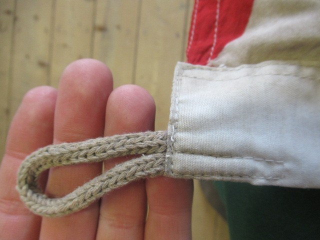 JAPANESE SECOND WORLD WAR ITEMS, comprising a sun flag, a silk script pennant and an Imperial Army Image