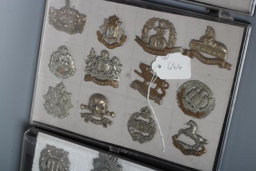 THIRTY TWO BRITISH MILITARY CAP BADGES including English and Scottish regiments, in three plastic Image