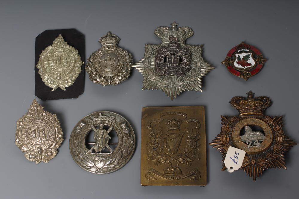A COLLECTION OF BRITISH MILITARY CAP BADGES AND PLAID BROOCHES including a Victorian Royal Irish Image