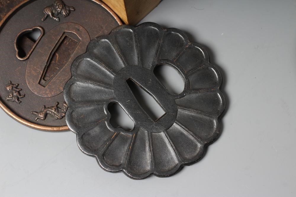 A COLLECTION OF KATANA ACCESSORIES comprising five tsuba, two cleaning kits and a four gokatana Image