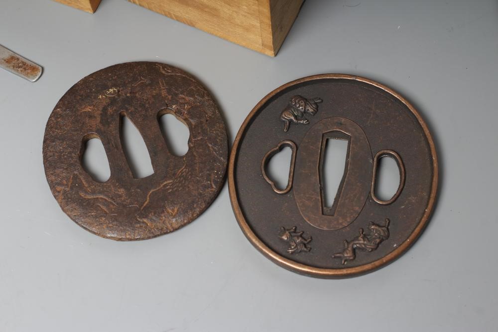 A COLLECTION OF KATANA ACCESSORIES comprising five tsuba, two cleaning kits and a four gokatana Image