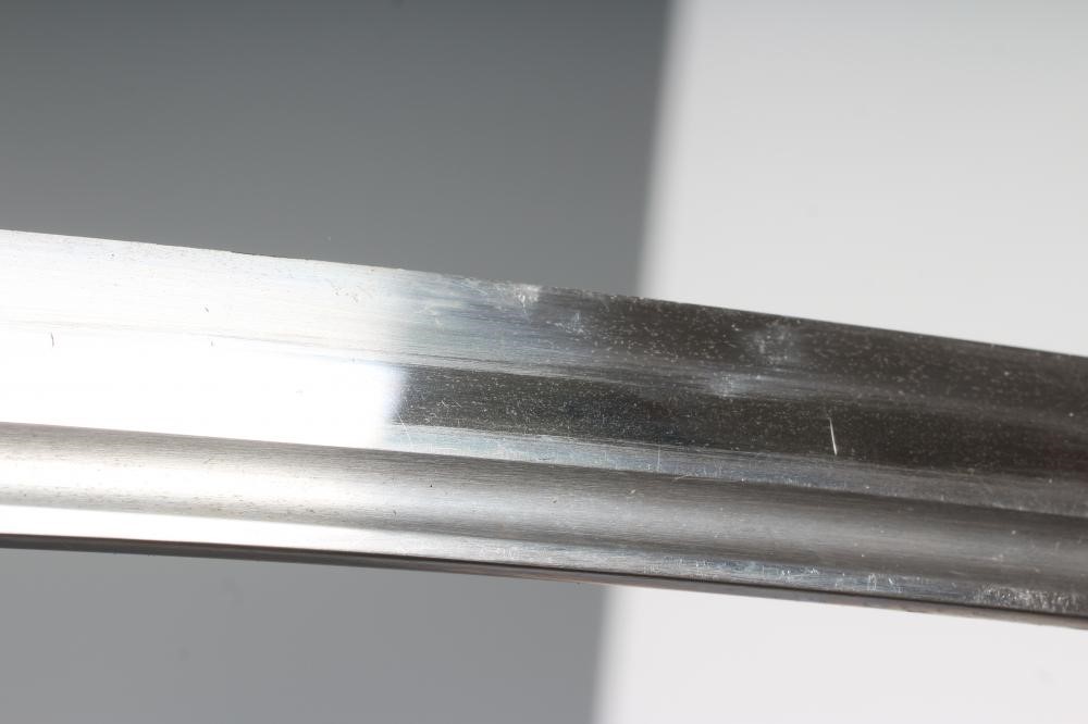 A JAPANESE WAKIZASHI with 11 3/8" fullered and curved blade, highly undulating hamon, unsigned tang Image