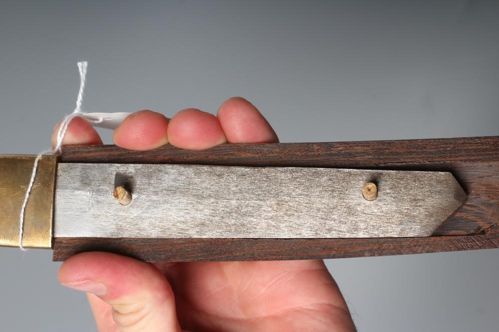 A JAPANESE WAKIZASHI with 11 3/8" fullered and curved blade, highly undulating hamon, unsigned tang Image