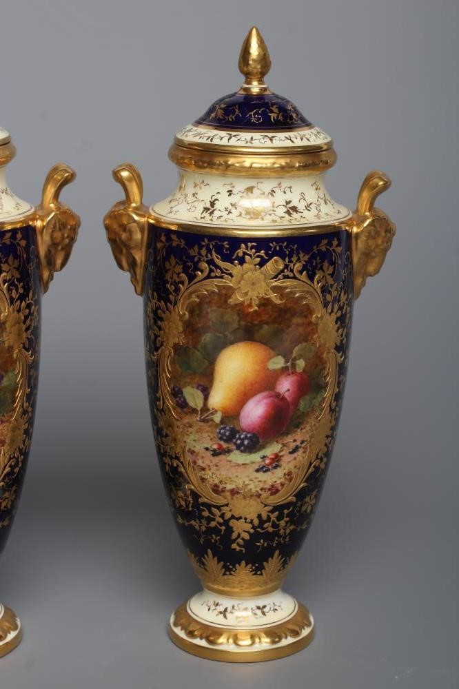 A PAIR OF COALPORT CHINA VASES AND COVERS Image