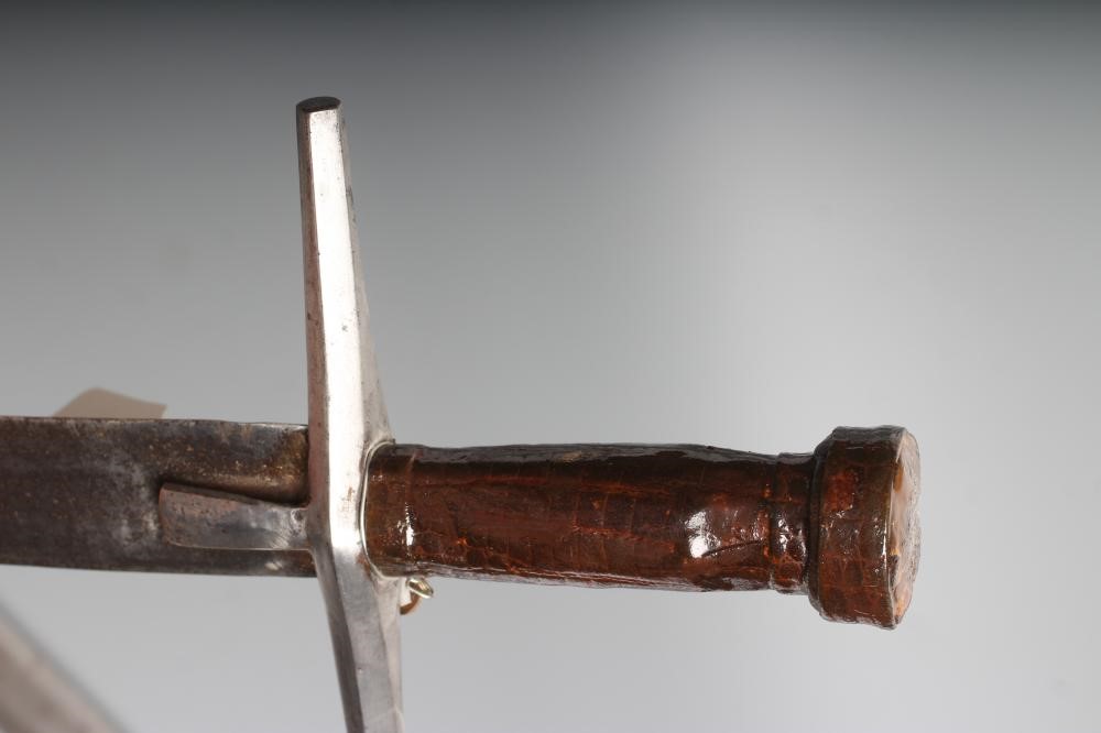 TWO AFRICAN HAUSA SWORDS comprising one of typical form with steel crossguard and leather grip, and Image