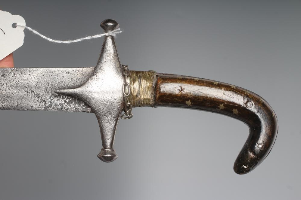 AN INDO-PERSIAN SHAMSHIR, possibly early 19th century, with 29 1/2" curved blade, steel crossguard Image