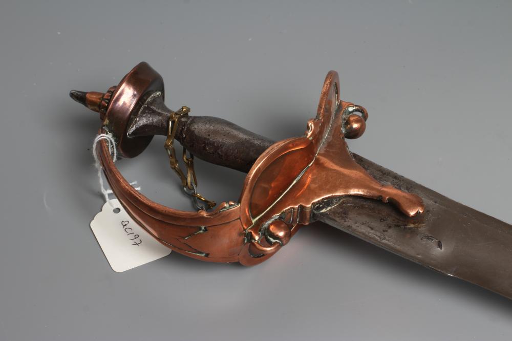 AN INDIAN TALWAR, possibly early 19th century, with 29 1/2" curved thick blade, brass and steel hilt Image