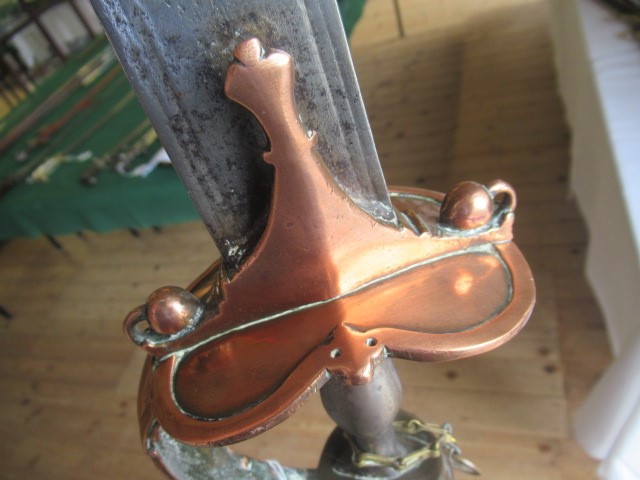 AN INDIAN TALWAR, possibly early 19th century, with 29 1/2" curved thick blade, brass and steel hilt Image