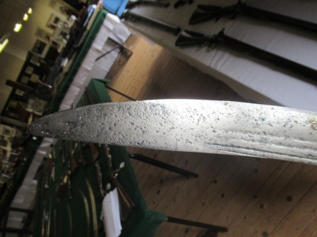 AN INDIAN TALWAR, possibly early 19th century, with 29 1/2" curved thick blade, brass and steel hilt Image