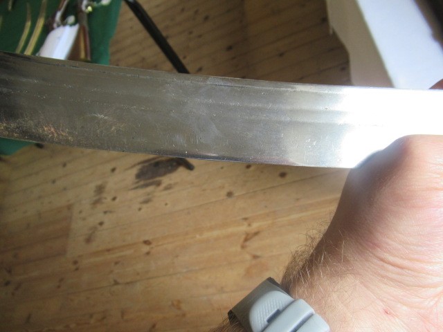 AN INDIAN TALWAR, possibly early 19th century, with 29 1/2" curved thick blade, brass and steel hilt Image