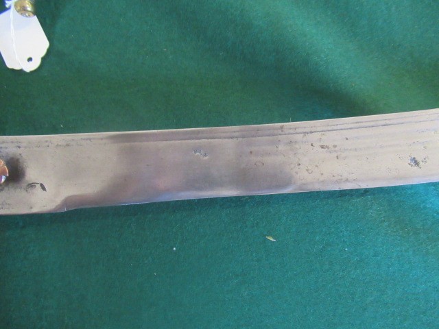 AN INDIAN TALWAR, possibly early 19th century, with 29 1/2" curved thick blade, brass and steel hilt Image