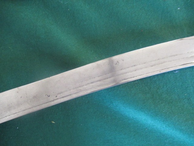 AN INDIAN TALWAR, possibly early 19th century, with 29 1/2" curved thick blade, brass and steel hilt Image