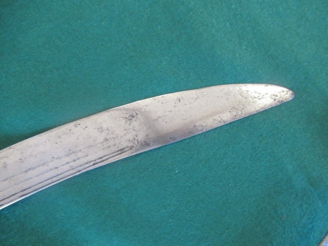AN INDIAN TALWAR, possibly early 19th century, with 29 1/2" curved thick blade, brass and steel hilt Image