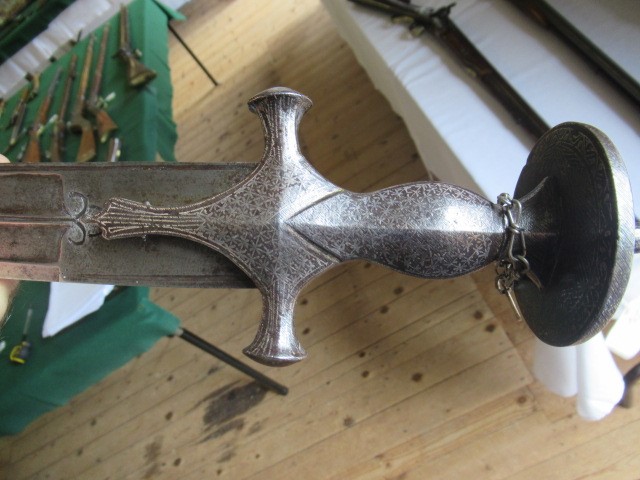 AN INDIAN TALWAR, 19th century, the 29 1/4" curved blade with fine fullers and edge shaping, and Image