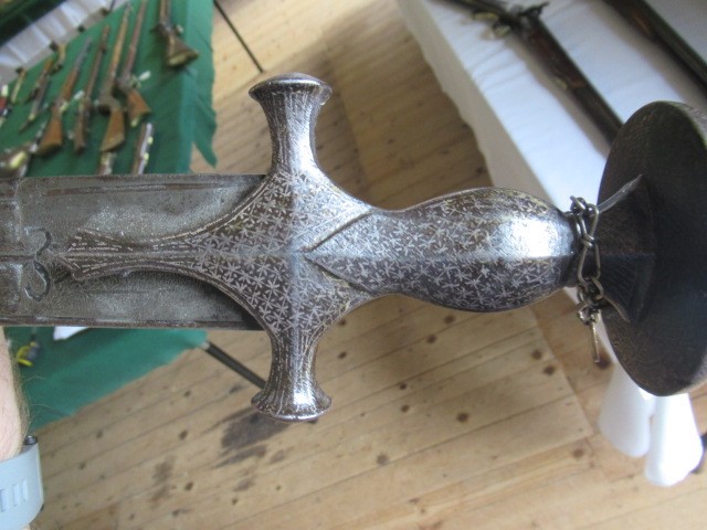 AN INDIAN TALWAR, 19th century, the 29 1/4" curved blade with fine fullers and edge shaping, and Image