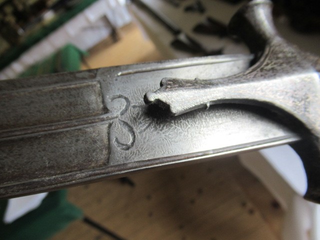 AN INDIAN TALWAR, 19th century, the 29 1/4" curved blade with fine fullers and edge shaping, and Image