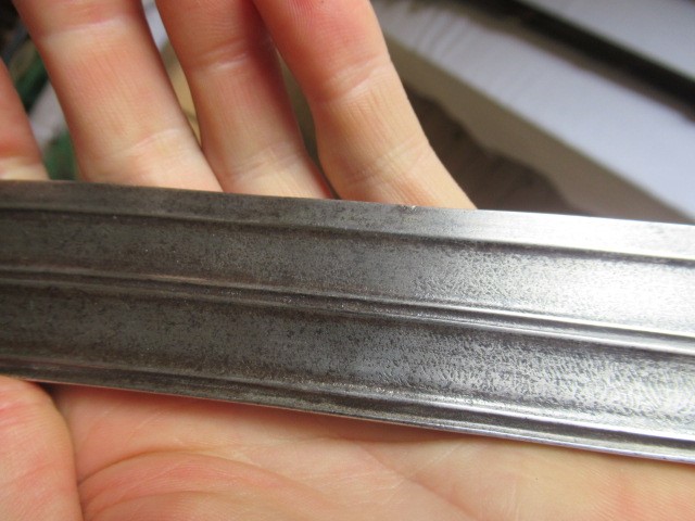 AN INDIAN TALWAR, 19th century, the 29 1/4" curved blade with fine fullers and edge shaping, and Image